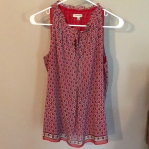 Red blouse with ruffle neck.